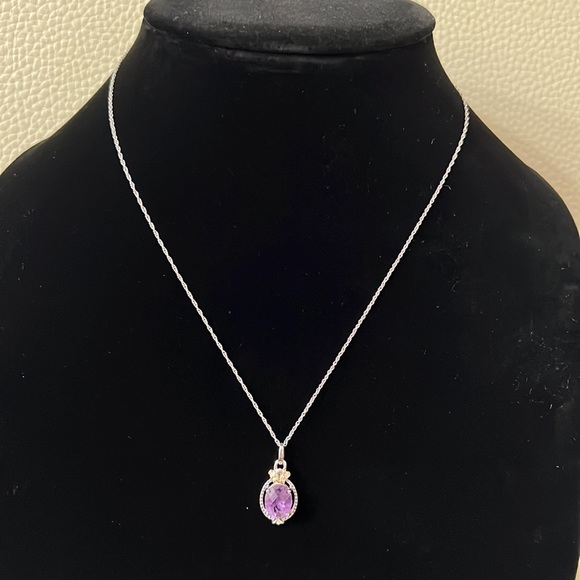 Jewelry - Silver necklace with purple crystal pendant with some gold accents/ used